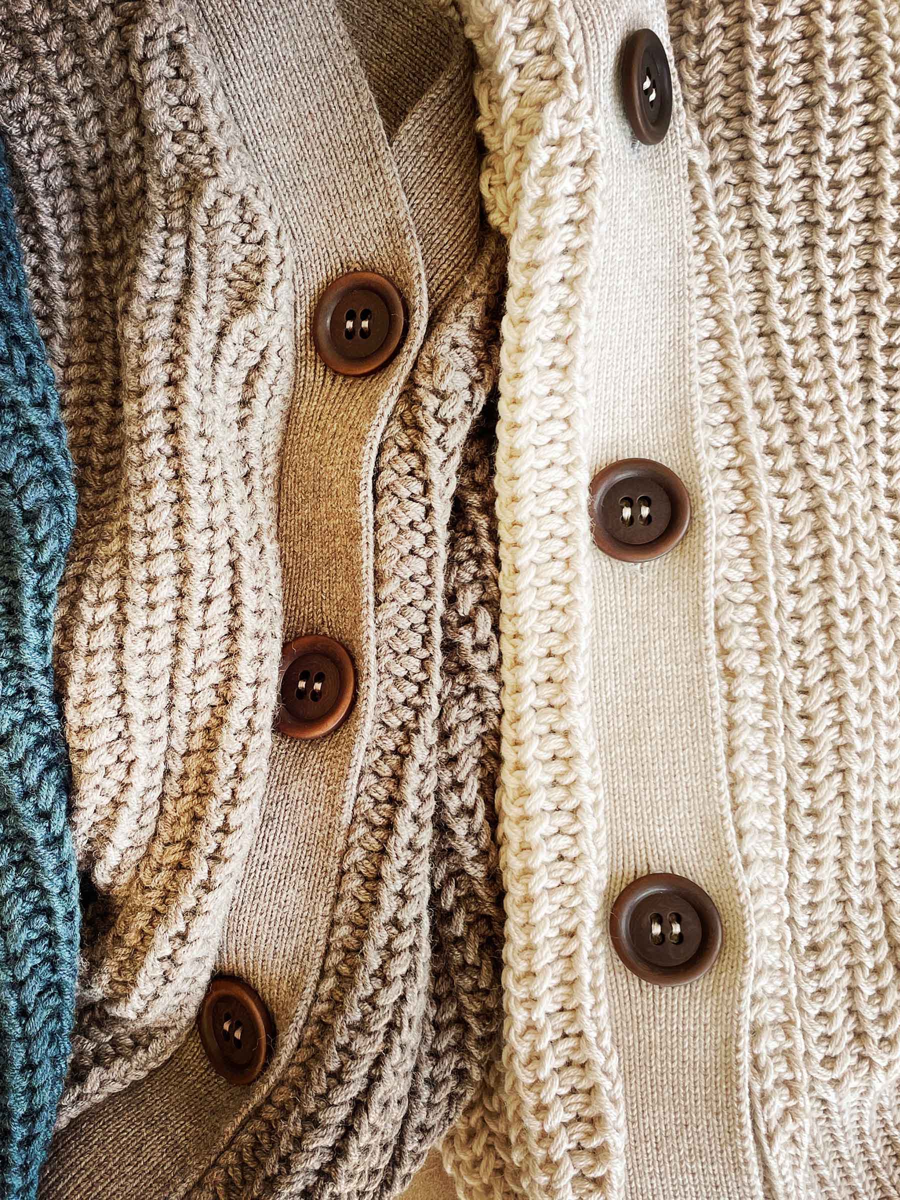Nui Organics Women's Bernard Cardigan — close-up of corozo nut buttons across multiple colourways including Deep Sea, Oatmeal and Natural