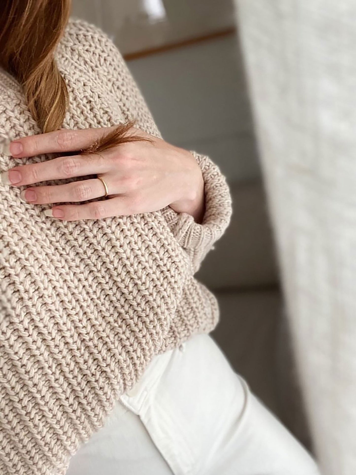 Nui Organics Women's Fishline Sweater in Oatmeal — close-up of chunky merino knit texture and ribbed cuff detail